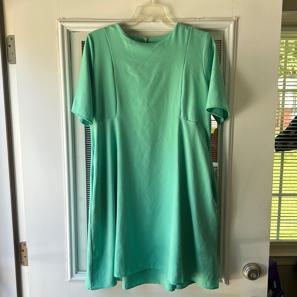 Mint green, baby doll fit dress with pockets and keyhole back